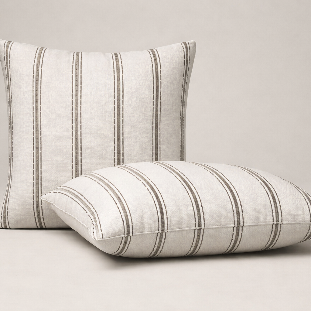 Two brown striped pillows on a beige background