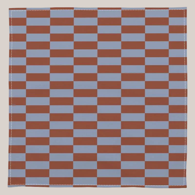Checkered pattern with alternating red and blue squares on a white background