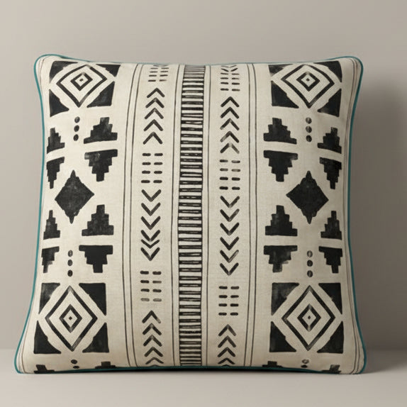 Decorative pillow with black geometric pattern on a white background
