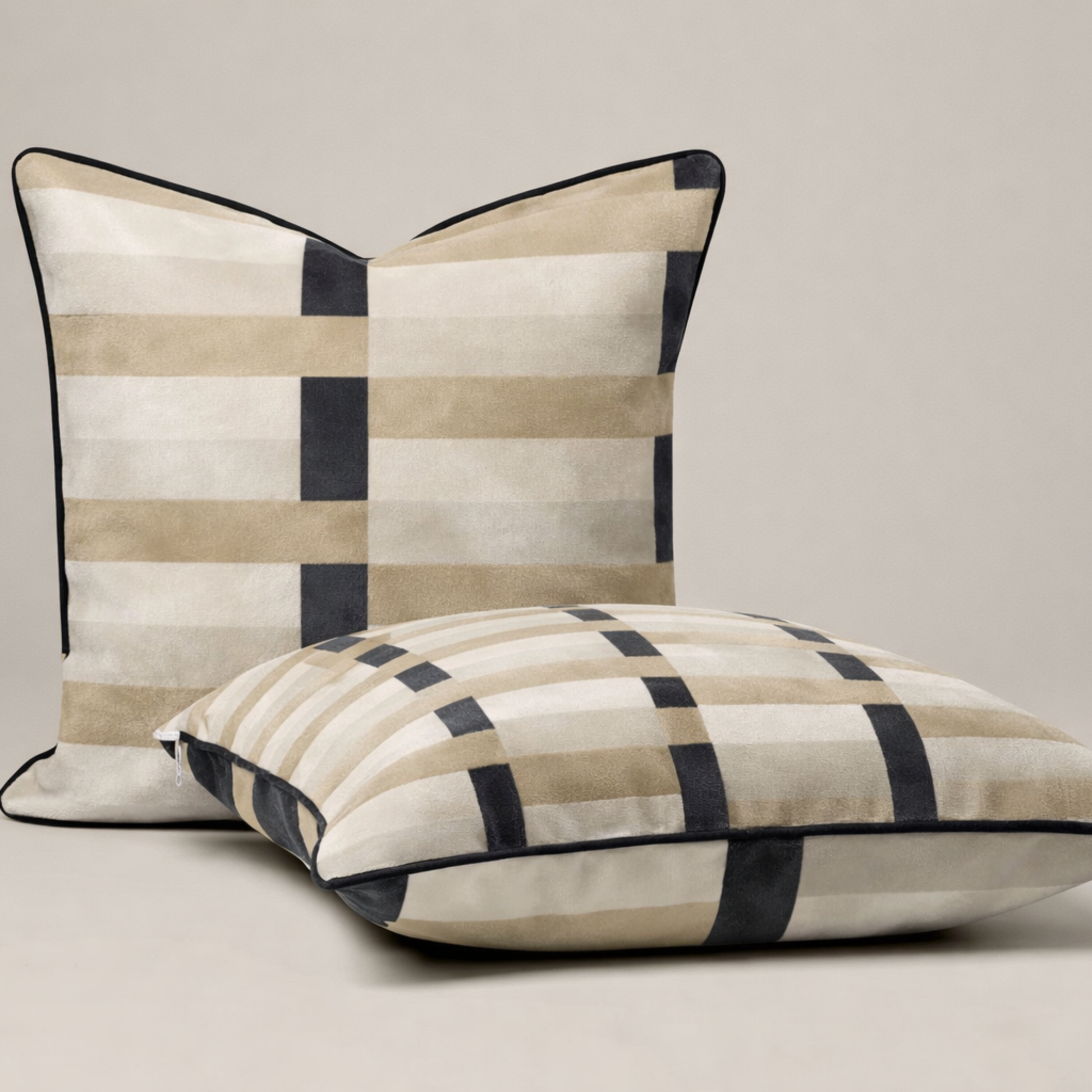 Two checkered pillows on a beige background