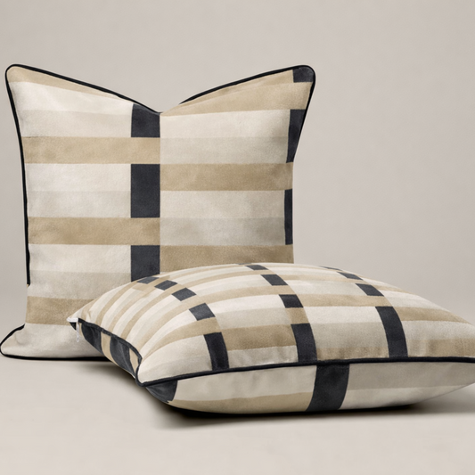 Two checkered pillows on a beige background