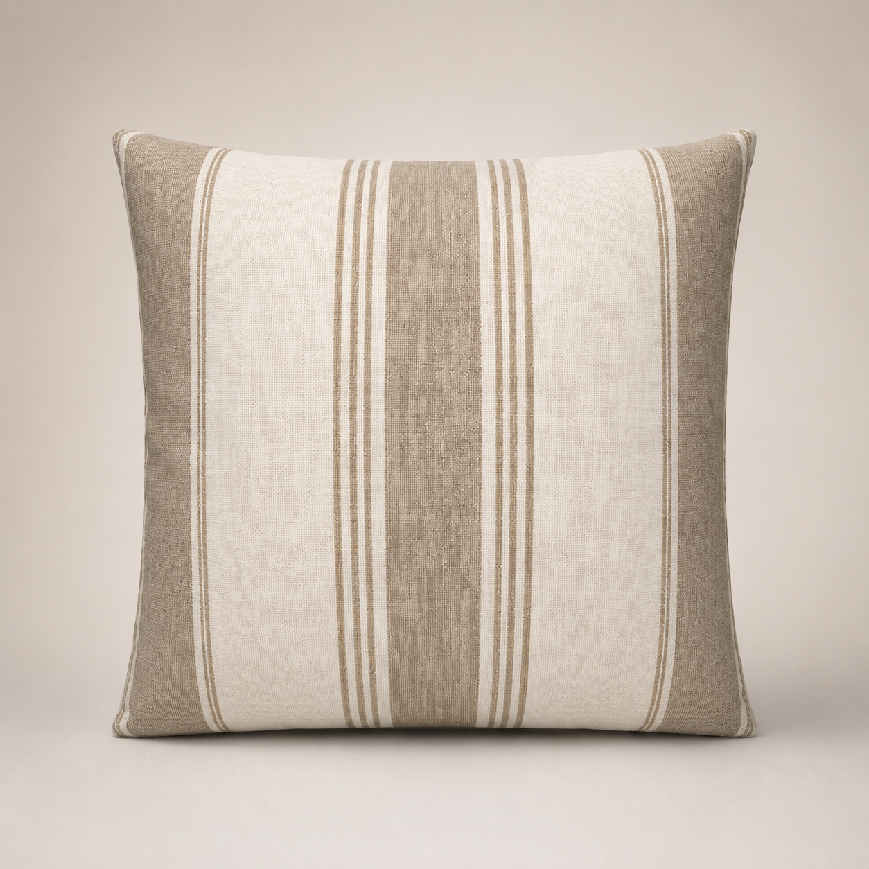 Striped pillow with beige and white pattern on a neutral background