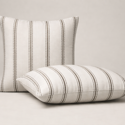 Two brown striped pillows on a beige background